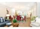 Open floor plan featuring dining area flowing into living room and kitchen space at 555 Letchas Ln, Alpharetta, GA 30009