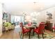 Open-concept dining area with a modern chandelier, seamlessly connected to the living space at 555 Letchas Ln, Alpharetta, GA 30009