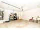 Spacious two car garage with utility sink and shelving, with room for storage at 555 Letchas Ln, Alpharetta, GA 30009