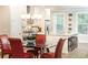 Open concept kitchen and dining area with stainless steel appliances, granite counters, and dining table at 555 Letchas Ln, Alpharetta, GA 30009