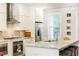 Bright kitchen featuring stainless steel appliances, granite countertops, and a stylish island at 555 Letchas Ln, Alpharetta, GA 30009
