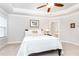 Spacious bedroom with tray ceiling, carpet, ceiling fan, and sunny windows at 555 Letchas Ln, Alpharetta, GA 30009