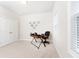 A well-lit home office features neutral walls, a functional desk setup, and a closet for storage at 555 Letchas Ln, Alpharetta, GA 30009