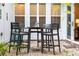 Outdoor patio featuring a bar height table with four chairs, and large window at 555 Letchas Ln, Alpharetta, GA 30009