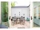 Covered outdoor patio with seating, providing an ideal space for outdoor dining and relaxation at 555 Letchas Ln, Alpharetta, GA 30009