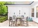 Charming covered patio with outdoor seating, perfect for entertaining or enjoying quiet moments at 555 Letchas Ln, Alpharetta, GA 30009