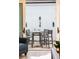 Cozy patio with high top table and chairs accessible from inside at 555 Letchas Ln, Alpharetta, GA 30009
