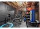 Home gym with weightlifting equipment, punching bag, and exercise accessories on rubber flooring at 5885 Wild Azalea Cv, Sugar Hill, GA 30518