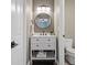 Compact bathroom with modern vanity and fixtures at 5885 Wild Azalea Cv, Sugar Hill, GA 30518
