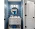 Charming bathroom featuring stylish fixtures, shiplap walls, and a modern vanity at 5885 Wild Azalea Cv, Sugar Hill, GA 30518