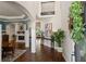 Grand foyer with hardwood floors, soaring ceilings, elegant columns, and view of dining and living spaces at 5885 Wild Azalea Cv, Sugar Hill, GA 30518