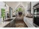 Well-equipped kitchen overlooks the living room offering seamless entertaining and lots of natural light at 5885 Wild Azalea Cv, Sugar Hill, GA 30518