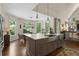 Bright kitchen features a farmhouse sink, stainless appliances, eat-in area, and natural light at 5885 Wild Azalea Cv, Sugar Hill, GA 30518