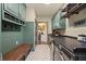 Well-appointed laundry room boasts modern cabinetry, countertops, and state-of-the-art appliances at 5885 Wild Azalea Cv, Sugar Hill, GA 30518