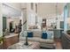 Spacious living room with an open floor plan, eat-in kitchen, and grand entry at 5885 Wild Azalea Cv, Sugar Hill, GA 30518
