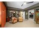 Home office featuring a large bookcase with a comfortable seating area at 5885 Wild Azalea Cv, Sugar Hill, GA 30518