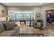 Open recreation room with a pool table and an arcade machine with an opening to a living room at 5885 Wild Azalea Cv, Sugar Hill, GA 30518