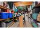 Organized storage room featuring built-in shelving, filled with containers and holiday decorations at 5885 Wild Azalea Cv, Sugar Hill, GA 30518