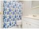 Small bathroom with blue and white shower curtain at 11 Forrest Pl, Atlanta, GA 30328