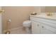Cozy bathroom featuring a toilet, vanity with sink, and gold fixtures at 11 Forrest Pl, Atlanta, GA 30328