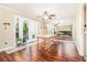 Bright dining area featuring hardwood floors, mirrored wall, and access to outdoor balcony at 11 Forrest Pl, Atlanta, GA 30328