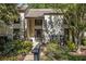 Exterior view of home with well-maintained landscaping and a walkway up to the front door at 11 Forrest Pl, Atlanta, GA 30328