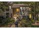 Exterior view of home with well-maintained landscaping and a walkway up to the front door at 11 Forrest Pl, Atlanta, GA 30328