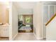 Bright hallway offering views into the living room featuring a fireplace at 11 Forrest Pl, Atlanta, GA 30328