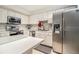 Bright kitchen featuring stainless steel appliances and white cabinetry at 11 Forrest Pl, Atlanta, GA 30328