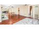 Spacious living room with hardwood floors and mirrored wall with a gray couch in the background at 11 Forrest Pl, Atlanta, GA 30328