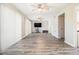 Spacious living room featuring modern flooring, ceiling fans and abundant natural light at 11 Forrest Pl, Atlanta, GA 30328