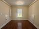 Neutral bedroom with hardwood flooring, recessed lighting, and two storage closets at 1417 Wind Chime Ct, Lawrenceville, GA 30045