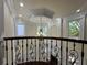 View from the second story of a foyer featuring a chandelier and decorative molding at 1417 Wind Chime Ct, Lawrenceville, GA 30045