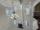Elegant living room with decorative molding, fireplace and chandelier at 1417 Wind Chime Ct, Lawrenceville, GA 30045