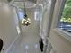 Bright living room with high ceilings, fireplace and tile floors at 1417 Wind Chime Ct, Lawrenceville, GA 30045