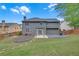 Spacious backyard with patio and a two-story house, great for outdoor activities at 1425 Bridle Path Dr, Lawrenceville, GA 30045
