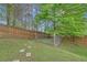 Fenced backyard with a dog run area, offering a safe space for pets at 1425 Bridle Path Dr, Lawrenceville, GA 30045