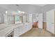 Bright bathroom featuring tile flooring, dual sinks, and a separate tub and shower at 1425 Bridle Path Dr, Lawrenceville, GA 30045