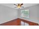 Bedroom with hardwood floors, ceiling fan and window offering natural light at 1425 Bridle Path Dr, Lawrenceville, GA 30045