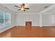 Bright living room with hardwood floors, a fireplace, and large windows at 1425 Bridle Path Dr, Lawrenceville, GA 30045