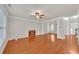 Spacious living room with hardwood floors, a fireplace, and plenty of natural light at 1425 Bridle Path Dr, Lawrenceville, GA 30045