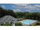 View of the community pool, recreation area, and lush landscaping at 1425 Bridle Path Dr, Lawrenceville, GA 30045