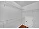 Walk-in closet with ample shelving, offering efficient storage solutions at 1425 Bridle Path Dr, Lawrenceville, GA 30045