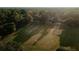 Aerial view of a baseball field surrounded by lush trees, a peaceful place for recreation and community activities at 156 Martha Ne Ave, Atlanta, GA 30317