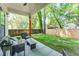 Covered patio with outdoor seating, a ceiling fan, and a view of the backyard at 156 Martha Ne Ave, Atlanta, GA 30317