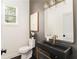 Modern powder room features a vessel sink, designer mirror, and stylish fixtures at 156 Martha Ne Ave, Atlanta, GA 30317