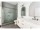 Modern bathroom with a glass-enclosed shower, double vanity, and sleek fixtures at 156 Martha Ne Ave, Atlanta, GA 30317