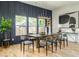 Dining room with wainscoting, modern light fixture, and floor to ceiling windows at 156 Martha Ne Ave, Atlanta, GA 30317