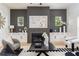 Stylish living room featuring a fireplace, built-in cabinets, and contemporary decor at 156 Martha Ne Ave, Atlanta, GA 30317