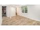 Spacious finished basement area with stylish wood-look tile flooring and natural light at 2429 Sherbrooke Ne Ct, Atlanta, GA 30345